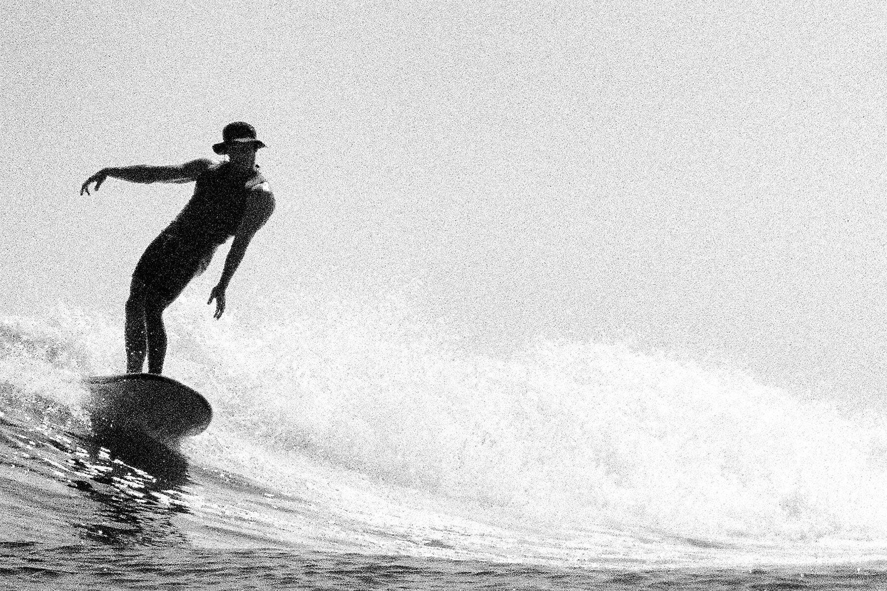 longboard surfer at malibu, captured on a nikonos by grant musso