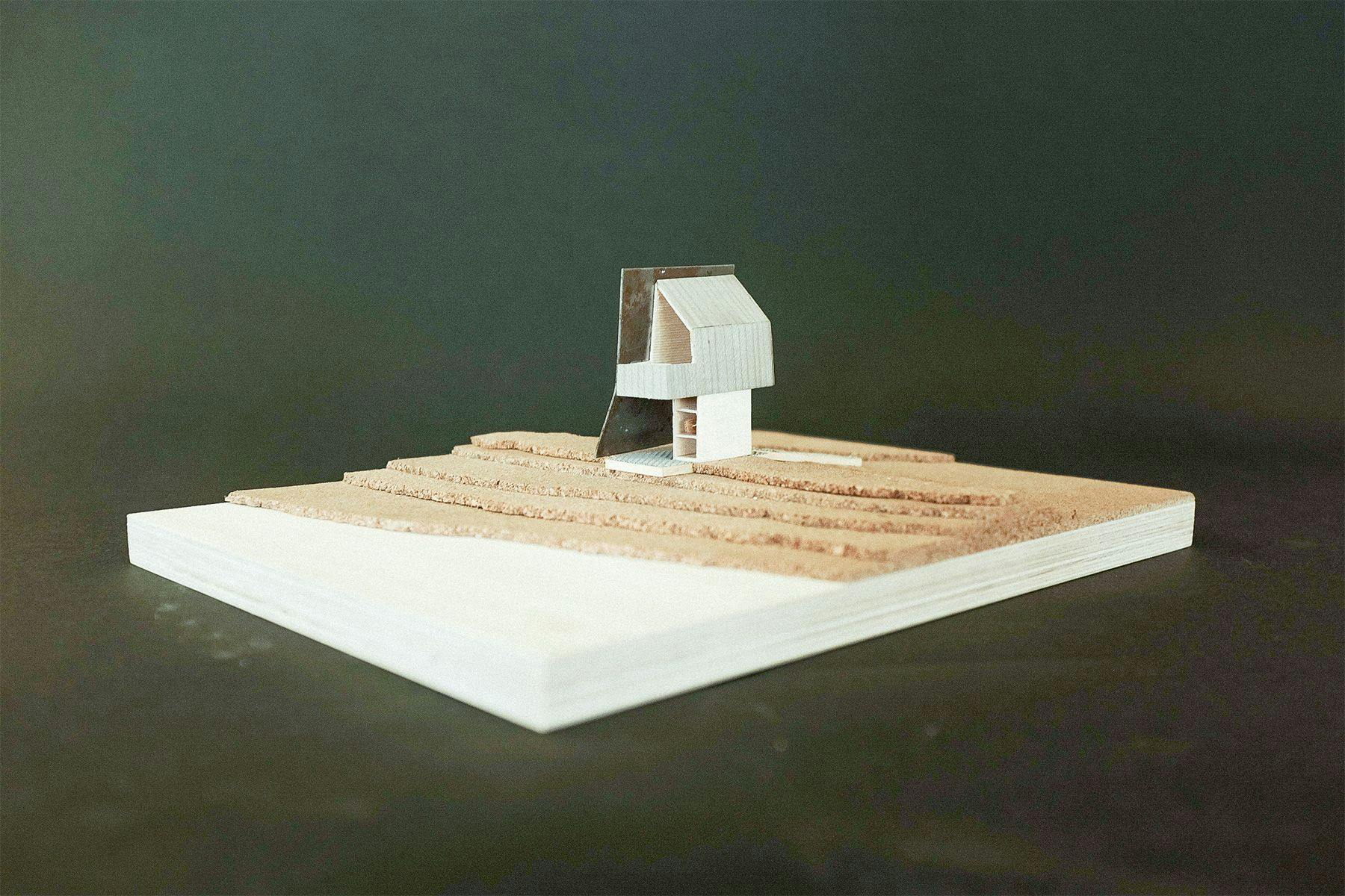 scale model of a surfboard look-out and storage structure