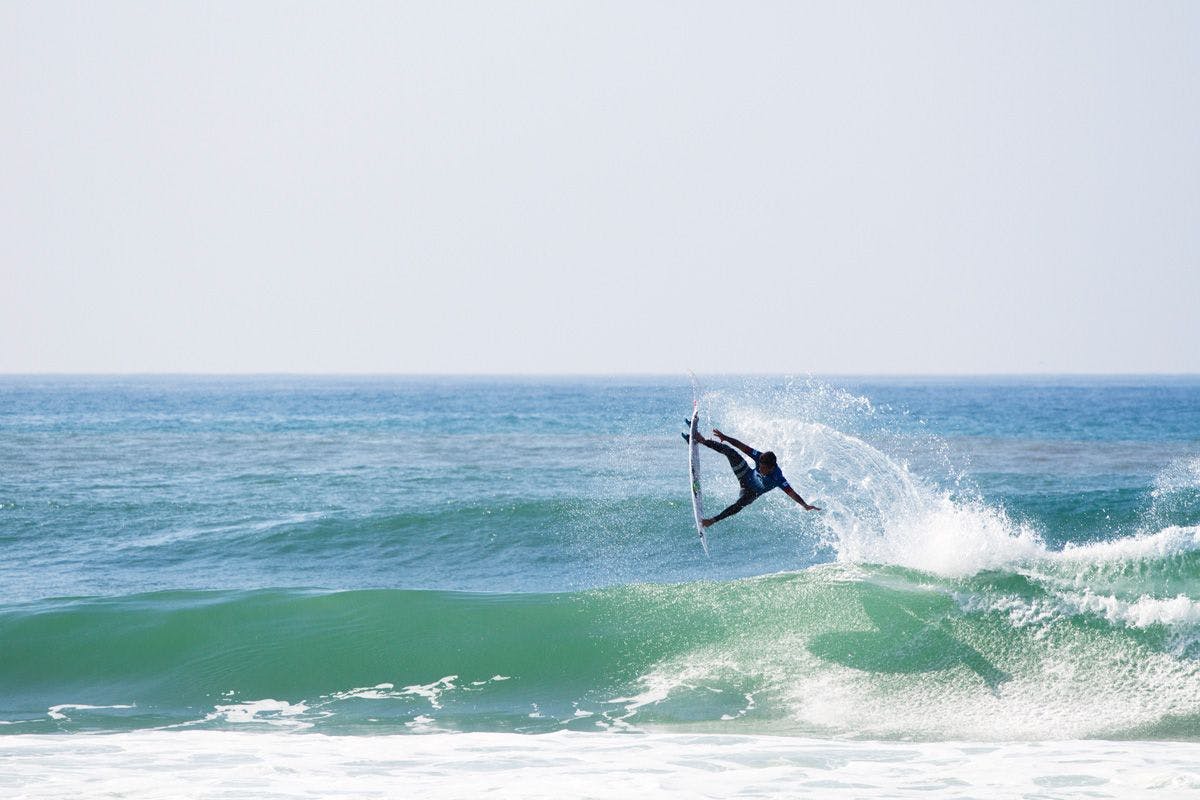 surfer miguel pupo launching an air during a contest heat
