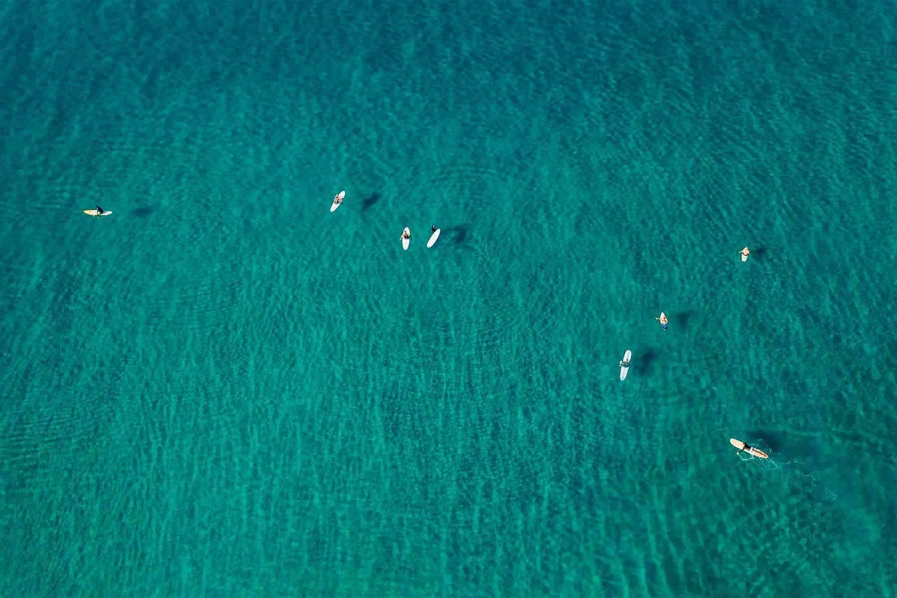 aerial view of surfers in the line-up at surf simply, playa guiones, costa rica