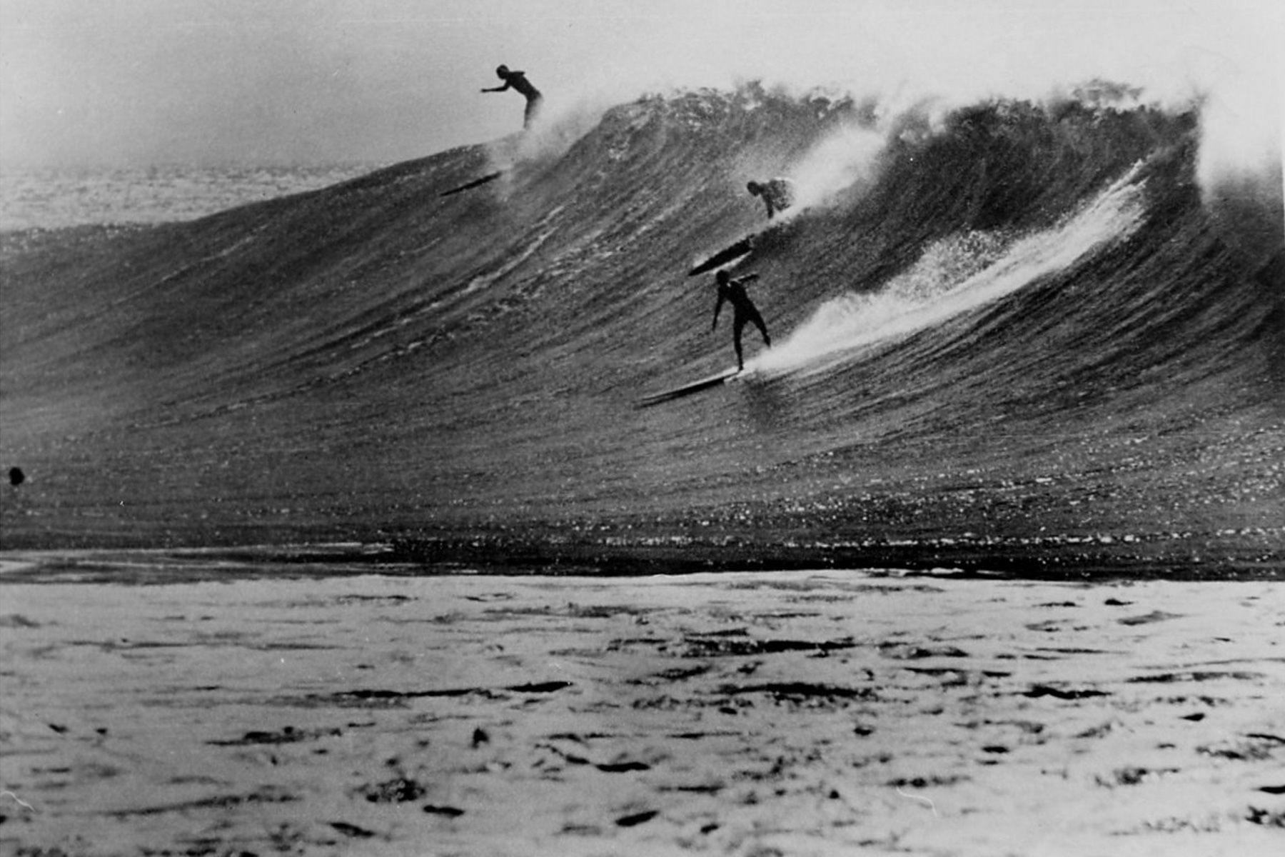 surfers at waimea bay, oahu, 1960s