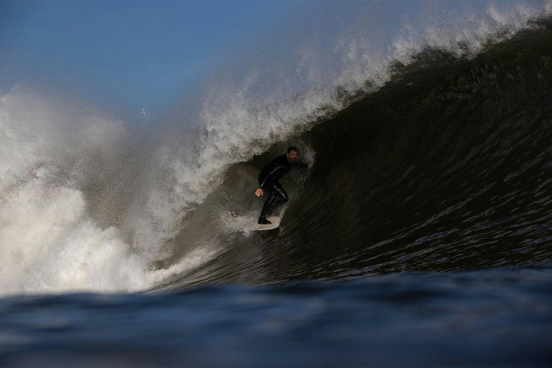 surfer gabe davies getting barreled in the northsea wearing a yulex natural rubber wetsuit