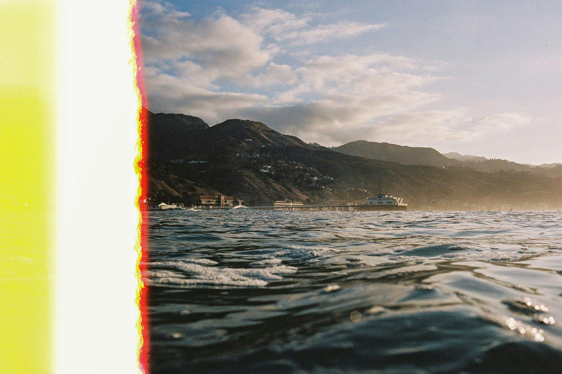 first on the roll film photo with light leak of malibu pier taken from the water by grant musso