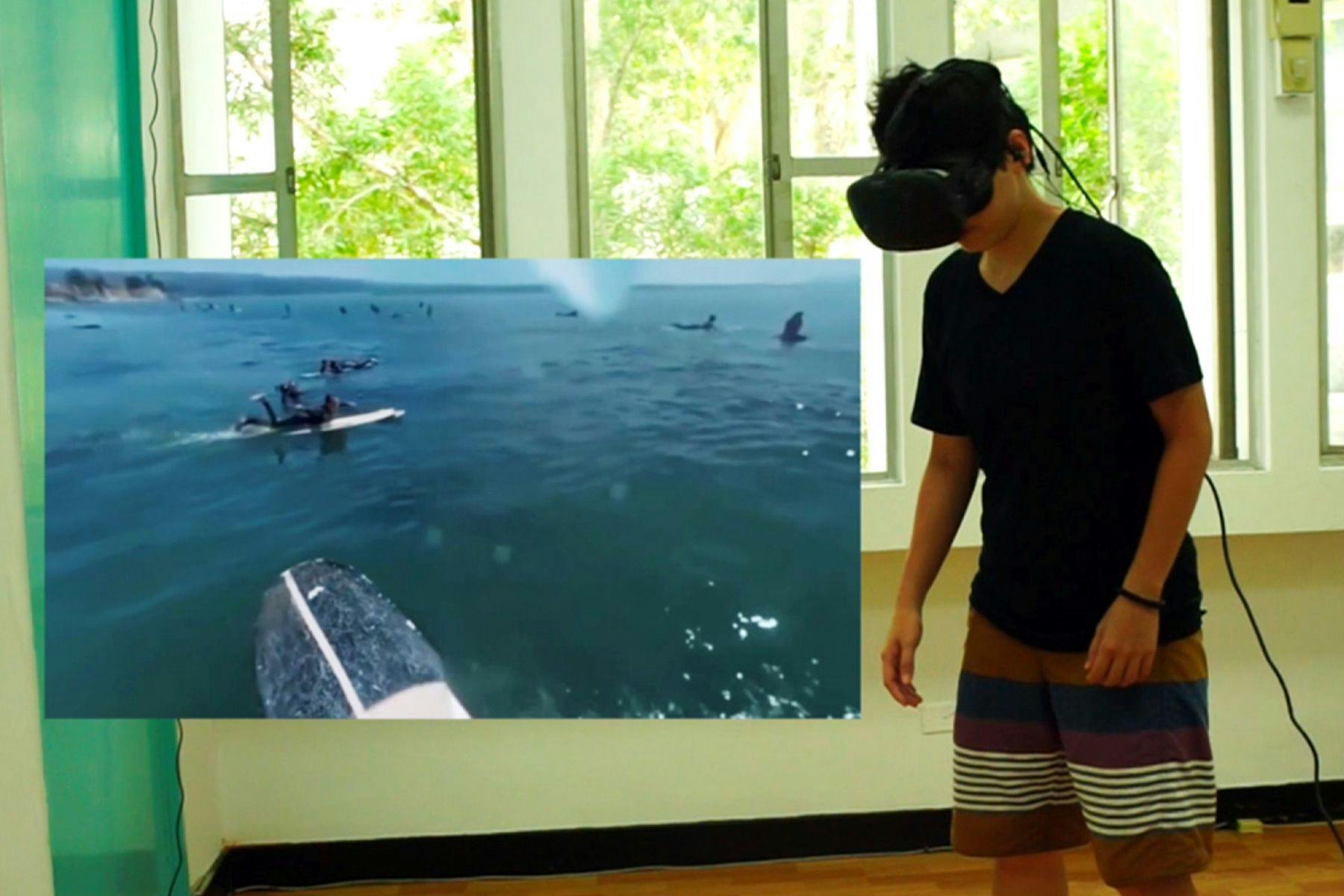 student participating in a virtual reality study about surfing