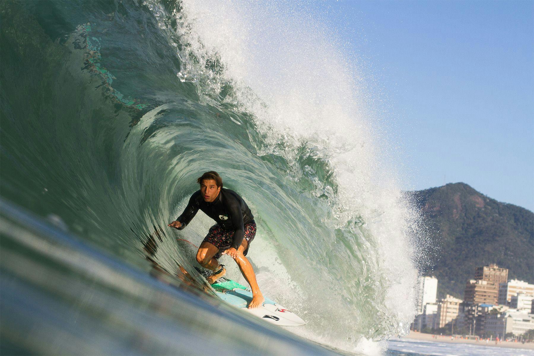 surfer in the barrel at ipanema, by ana catarina
