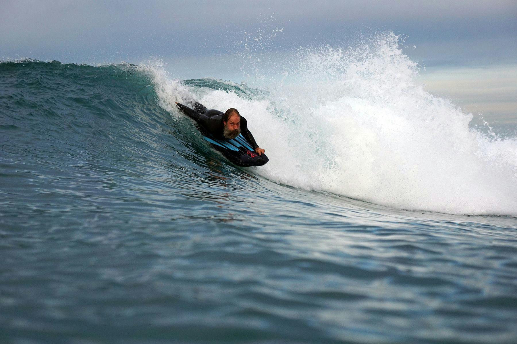 James Sowell riding a wave in Southern California. Photographed by Chad Stickney/HCW Camera Waterhousings.