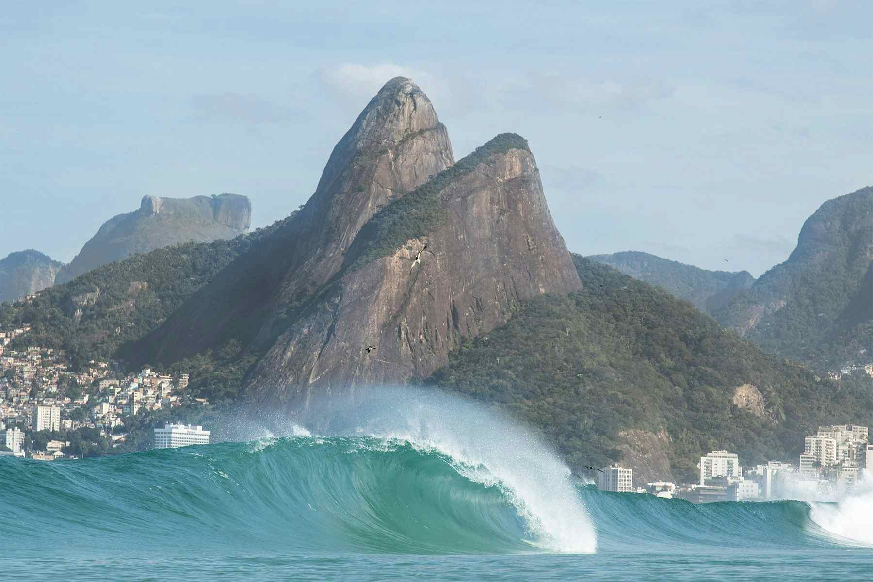 wave breaking at ipanema, brazil