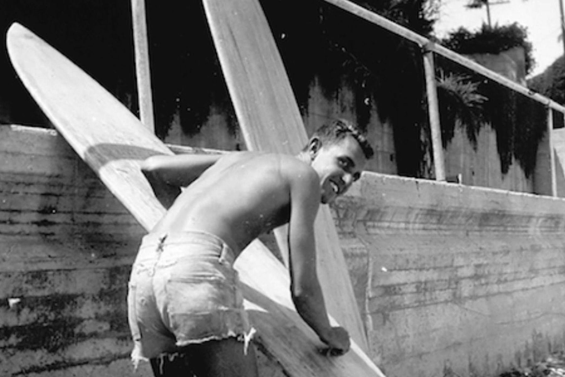 dick metz waxing a surfboard in the 1950s
